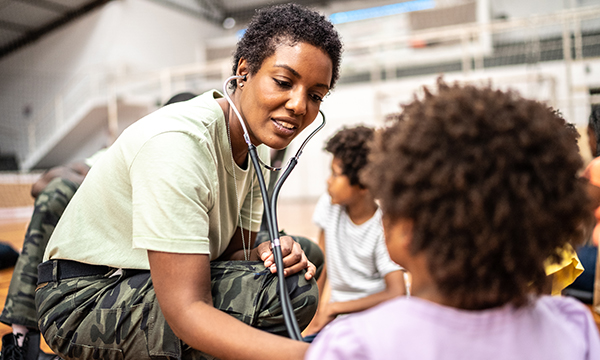 Community health nurse working with patient in school.