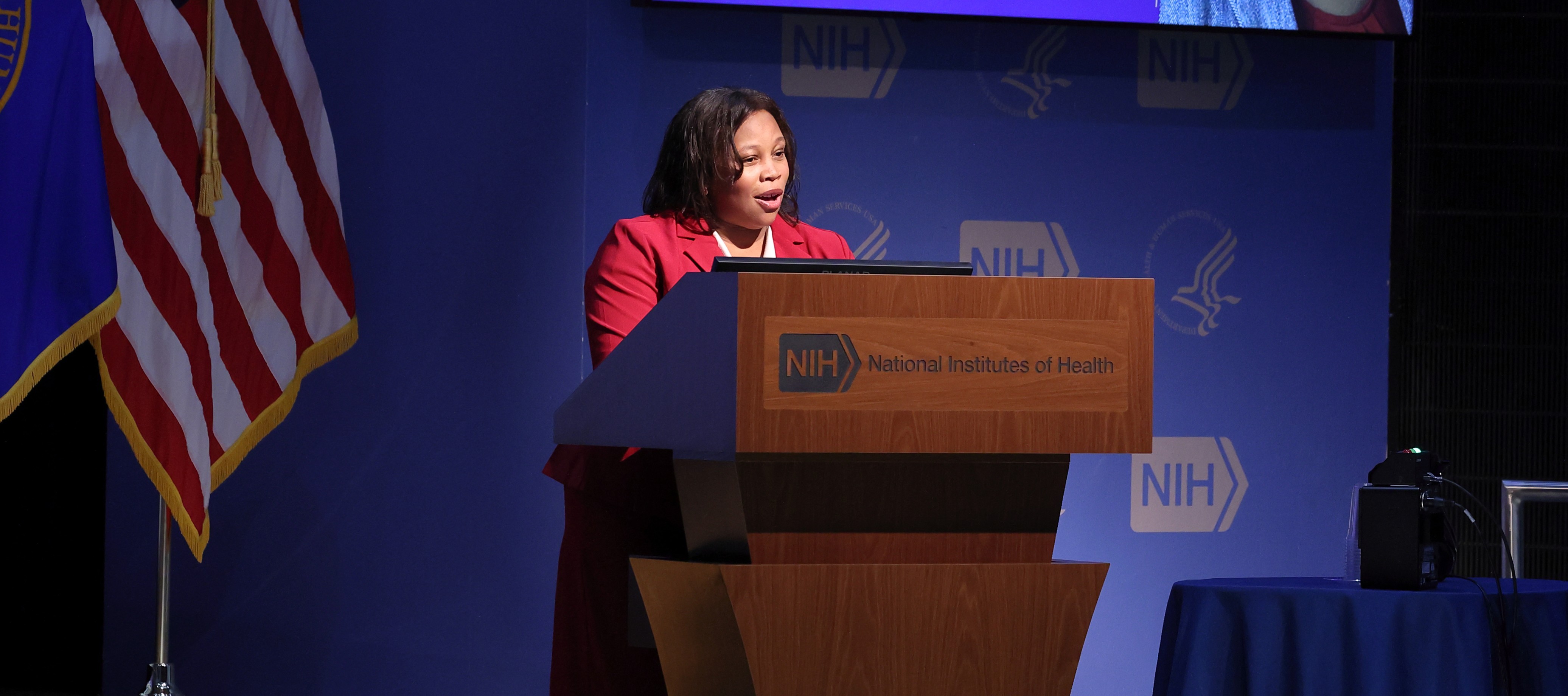 Dr. Aklin giving a speech