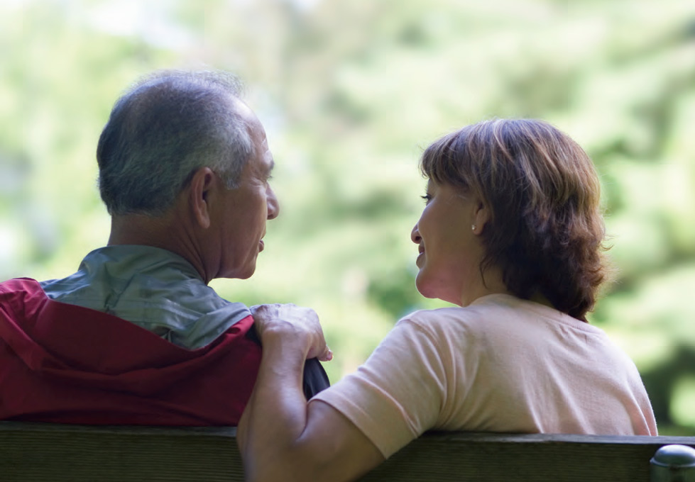 elderly-couple-sitting-on-bench-pc.jpg