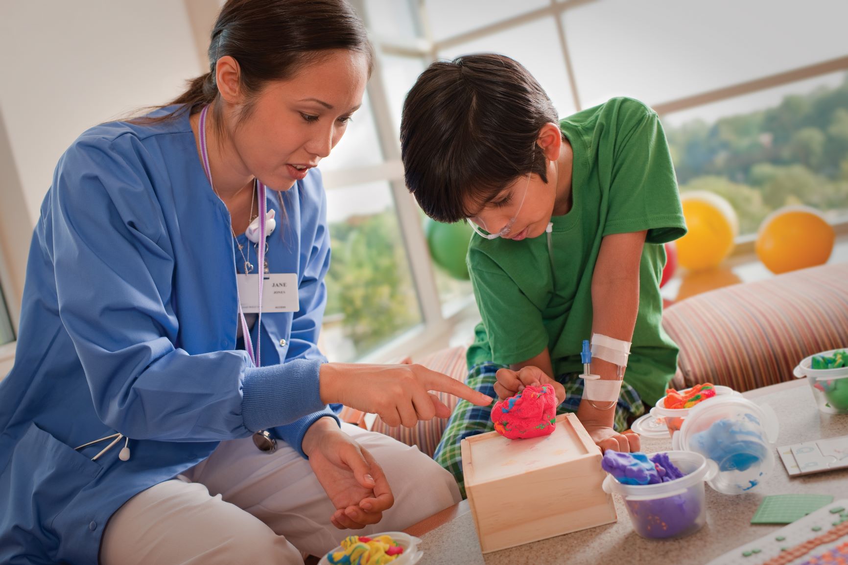 photo of nurse and young boy