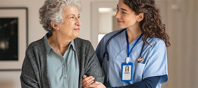 nurse and elderly female patient