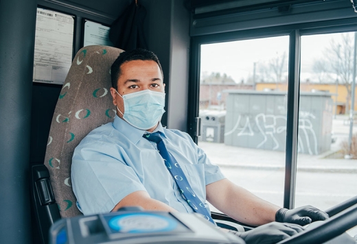 a bus driver in a mask